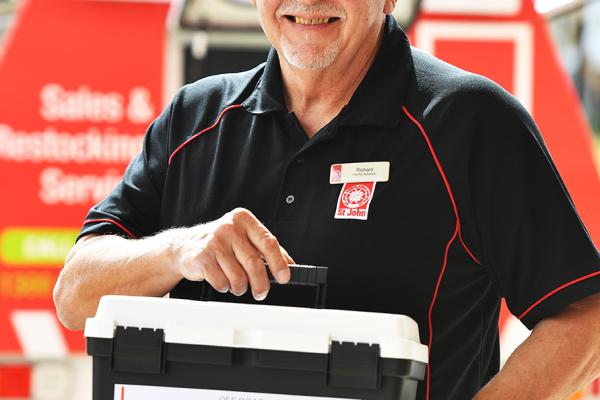 Man Holding First Aid Kit